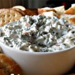 Best Spinach Dip Ever Recipe - A flavorful spinach mixture fills a tasty bread bowl. #spinach #spinachdip #spinachdiprecipe #spinachrecipe #spinachrecipes #recipes