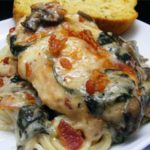Chicken Florentine Casserole Recipe - which can also be adapted with either fish or shrimp, lies on a bed of spinach leaves and mushrooms #chicken #chickenrecipe #chickenrecipes #chickenflorentine #chickenflorentinecasserole #chickencasserole #chickencasserolerecipe #casserole #casserolerecipes