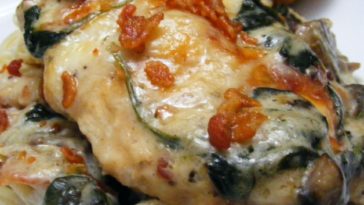 Chicken Florentine Casserole Recipe - which can also be adapted with either fish or shrimp, lies on a bed of spinach leaves and mushrooms #chicken #chickenrecipe #chickenrecipes #chickenflorentine #chickenflorentinecasserole #chickencasserole #chickencasserolerecipe #casserole #casserolerecipes