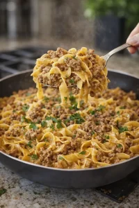 Creamy beef and noodles in garlic Parmesan sauce served in a bowl.
